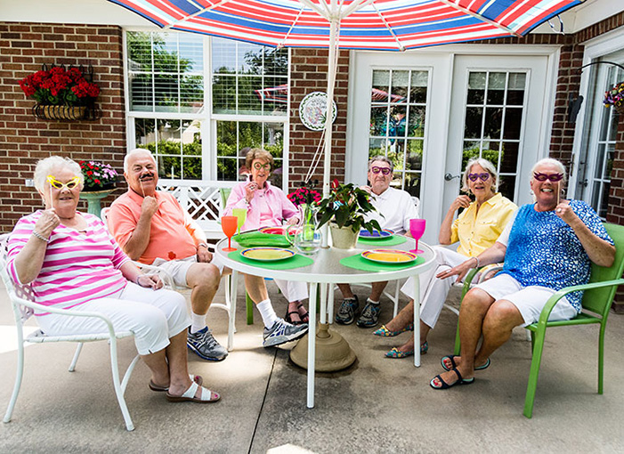 Residents having a party on the back patio of the cottage